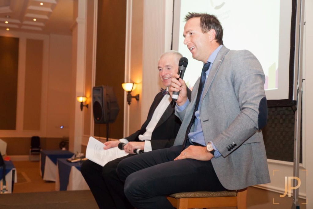 Dave Bayliss (in dinner suit) taking a question-and-answer session with former England cricket captain Michael Vaughan